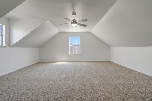 bonus room featuring ceiling fan, carpet floors, and vaulted ceiling