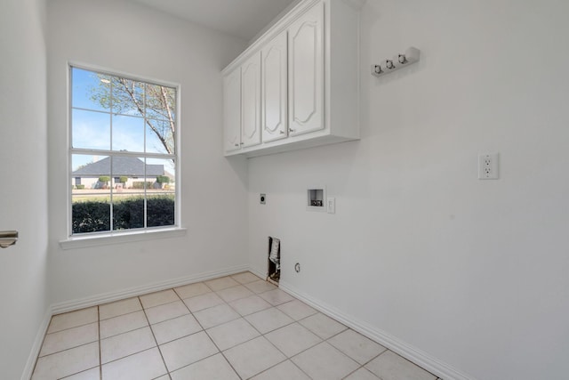 washroom with electric dryer hookup, cabinets, gas dryer hookup, hookup for a washing machine, and light tile patterned floors