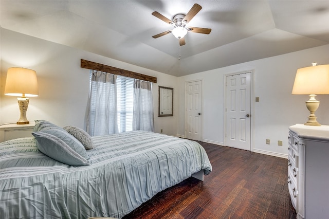 bedroom with dark hardwood / wood-style floors, ceiling fan, and lofted ceiling