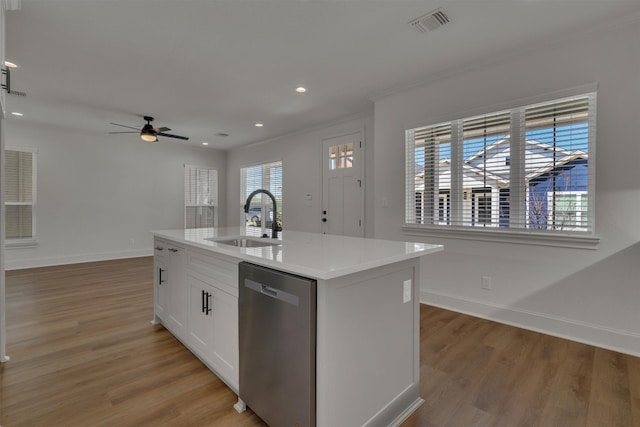 kitchen featuring light hardwood / wood-style floors, a center island with sink, white cabinets, dishwasher, and sink