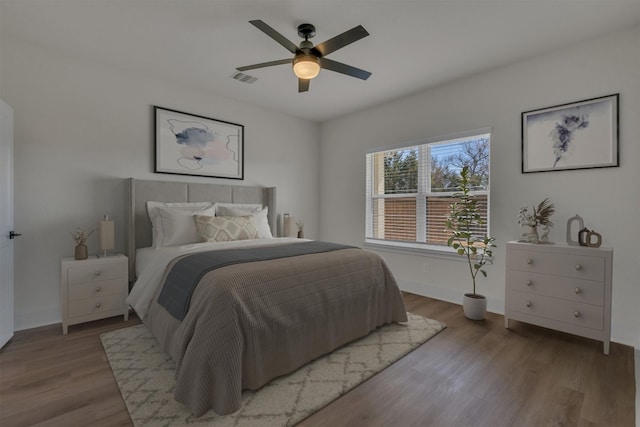 bedroom featuring ceiling fan and hardwood / wood-style flooring