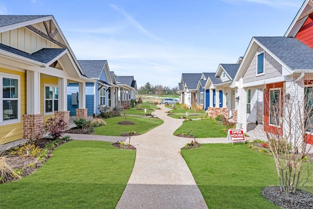 surrounding community featuring a lawn