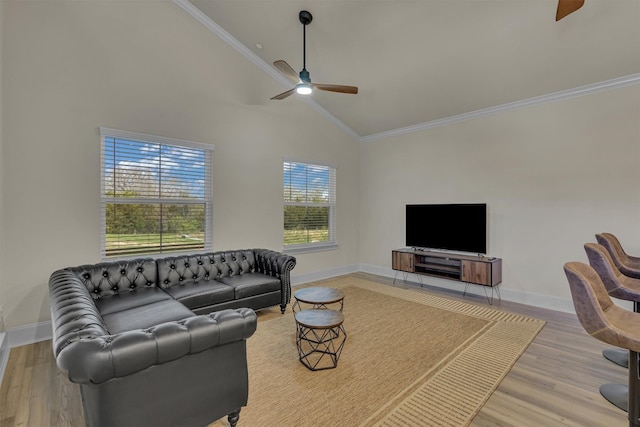 living room with high vaulted ceiling, crown molding, ceiling fan, and light wood-type flooring