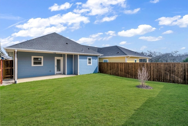 back of property featuring a yard and a patio