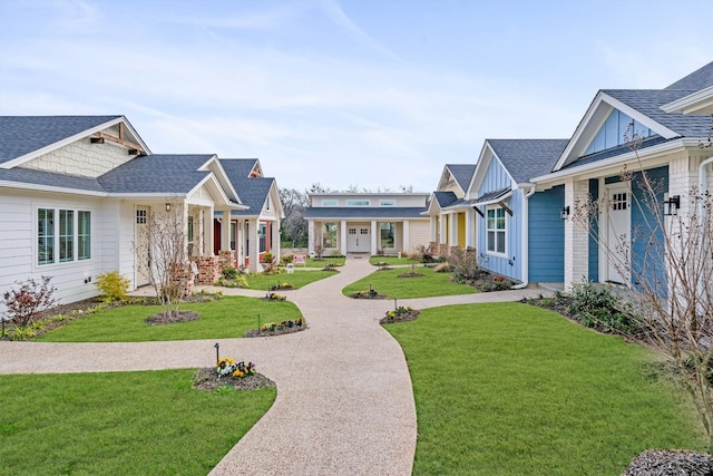 craftsman inspired home featuring covered porch and a front yard