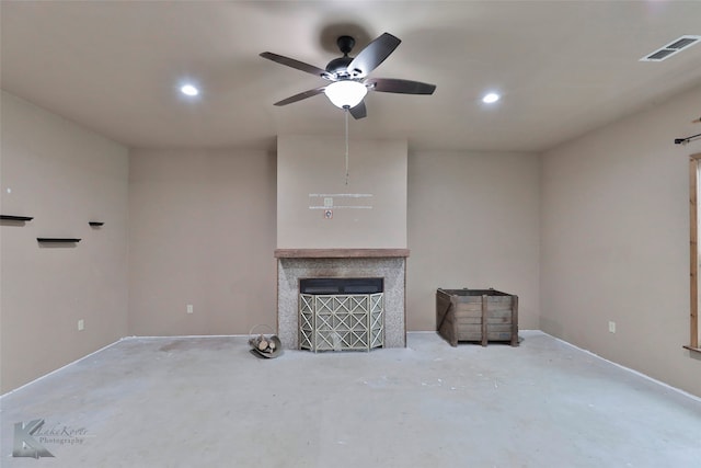 unfurnished living room with concrete floors and ceiling fan