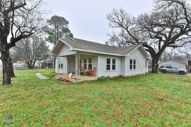 view of side of home featuring a yard