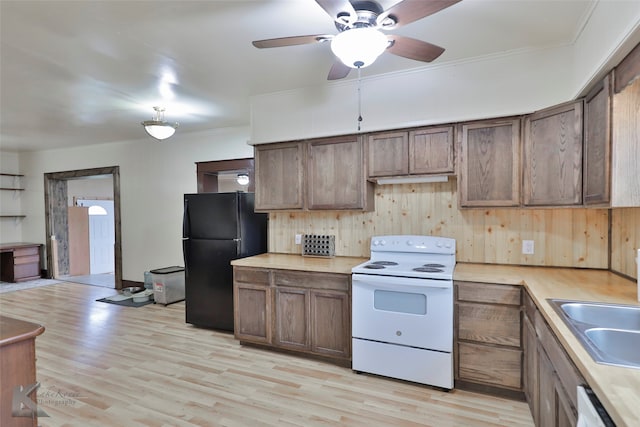 kitchen featuring sink, light wood-type flooring, ceiling fan, and white appliances