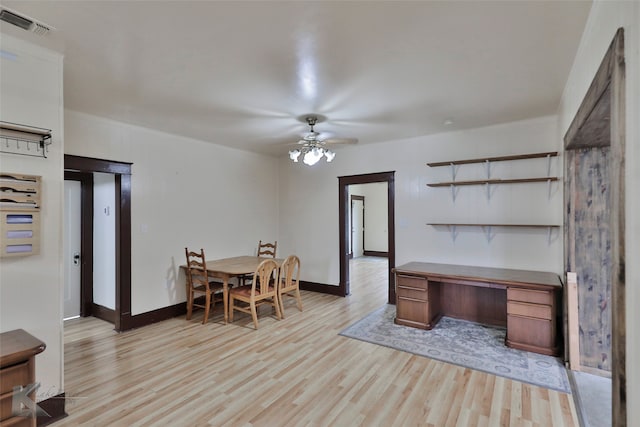 dining room with light hardwood / wood-style flooring and ceiling fan