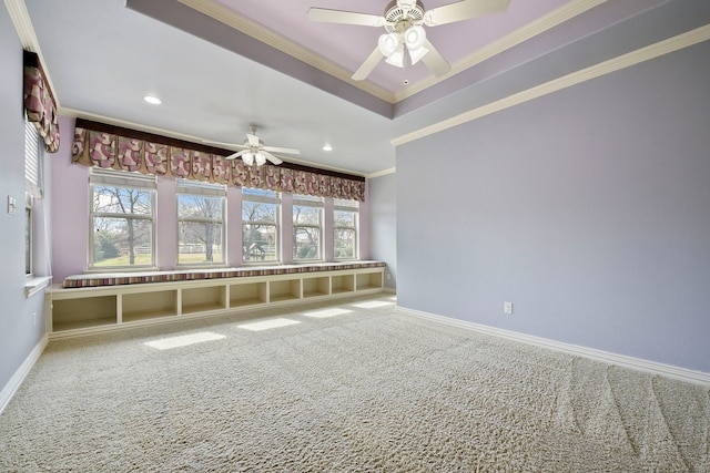 unfurnished living room featuring carpet flooring, ornamental molding, and ceiling fan