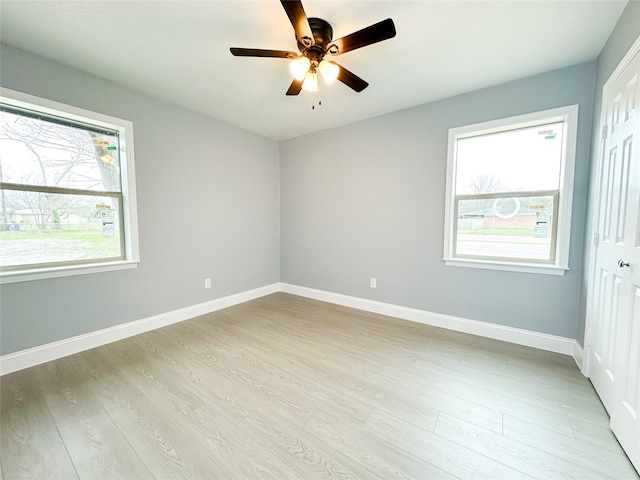 unfurnished room with light hardwood / wood-style flooring and ceiling fan