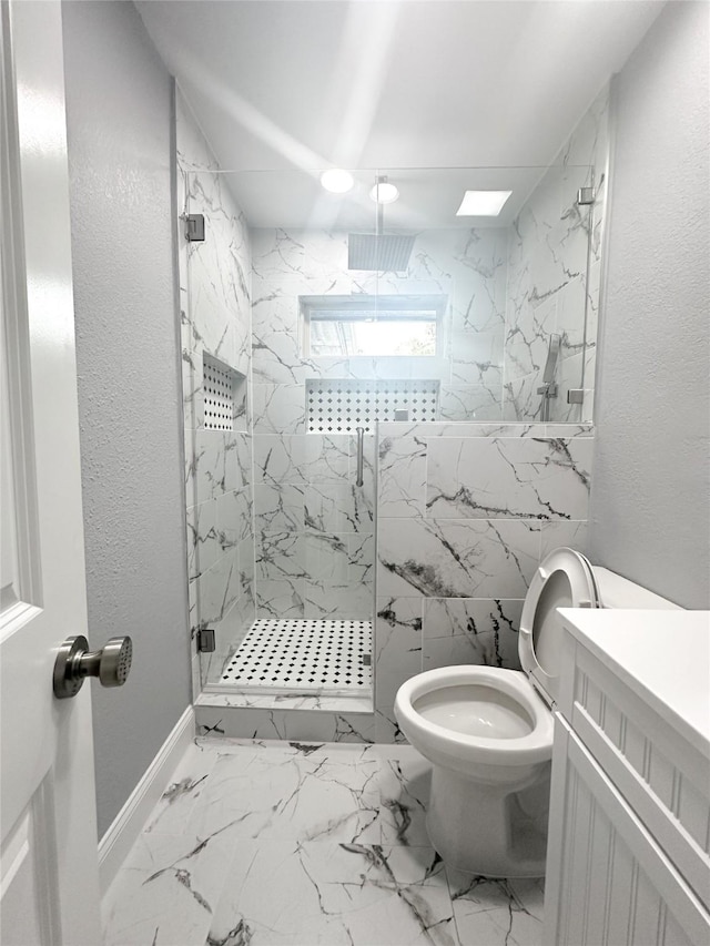 bathroom with baseboards, toilet, a textured wall, and a marble finish shower