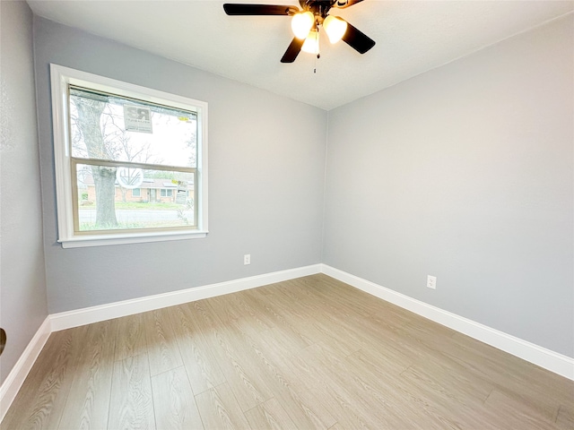 unfurnished room featuring light hardwood / wood-style flooring and ceiling fan