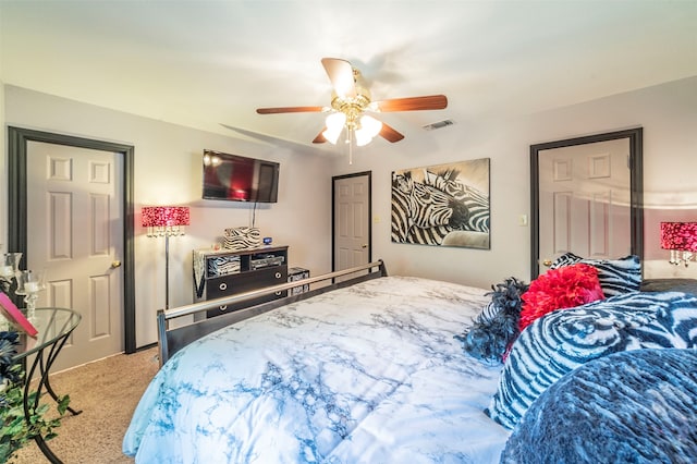 carpeted bedroom with ceiling fan