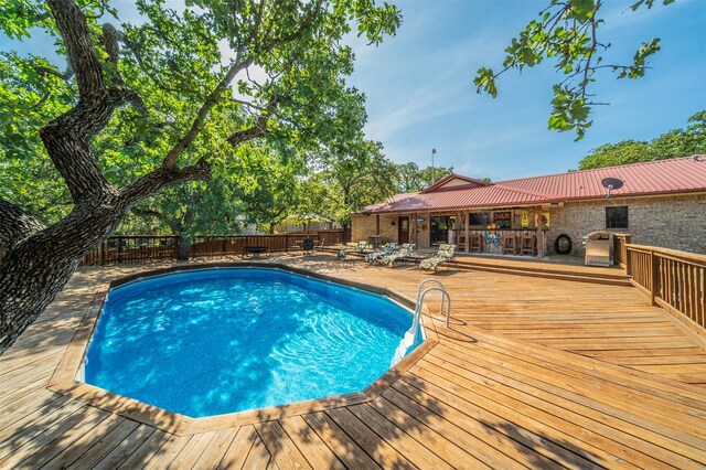 view of pool with a deck