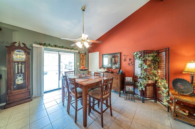 tiled dining room with high vaulted ceiling and ceiling fan