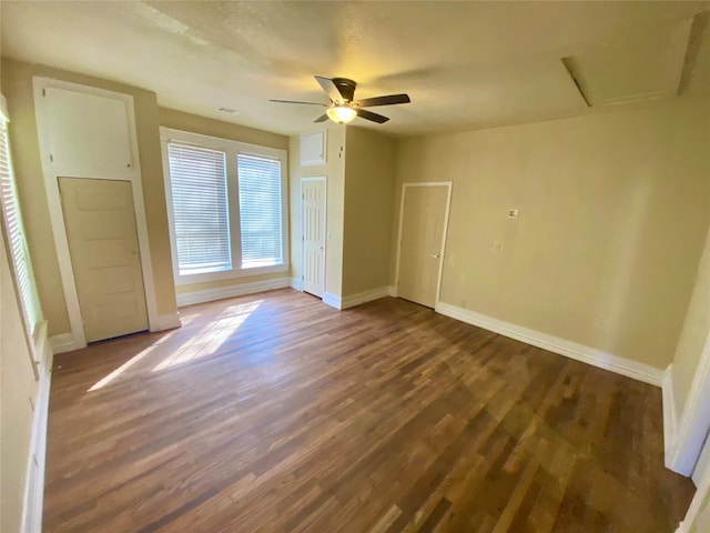 unfurnished bedroom featuring dark hardwood / wood-style flooring and ceiling fan