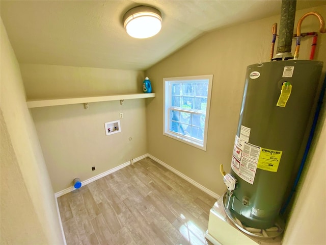 washroom featuring water heater, light hardwood / wood-style floors, hookup for an electric dryer, and hookup for a washing machine