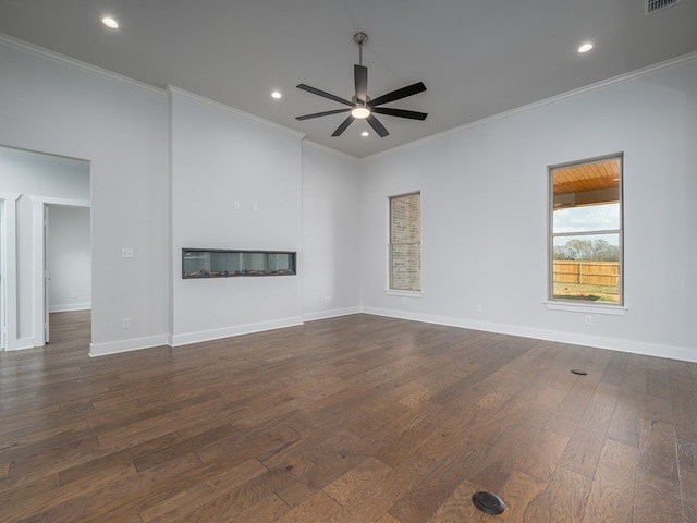 interior space featuring dark hardwood / wood-style floors, ceiling fan, and ornamental molding