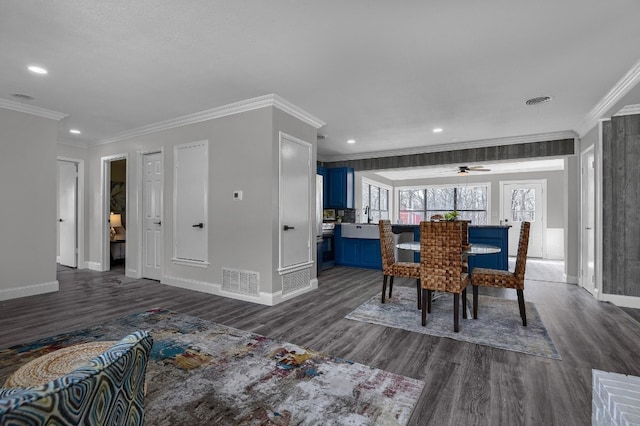 dining room featuring ceiling fan, crown molding, and dark hardwood / wood-style floors