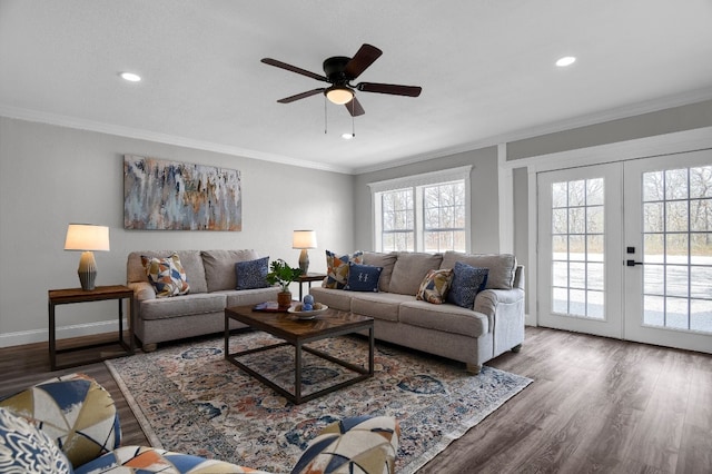 living room with ceiling fan, crown molding, dark hardwood / wood-style floors, and a healthy amount of sunlight