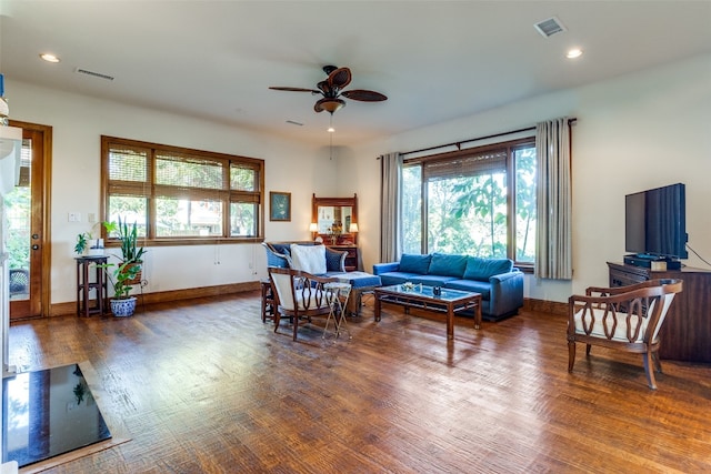 living room featuring hardwood / wood-style flooring and ceiling fan