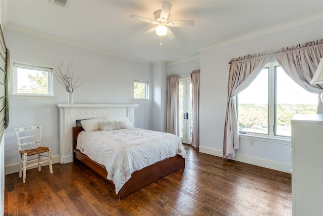 bedroom with multiple windows, ceiling fan, dark hardwood / wood-style flooring, and ornamental molding