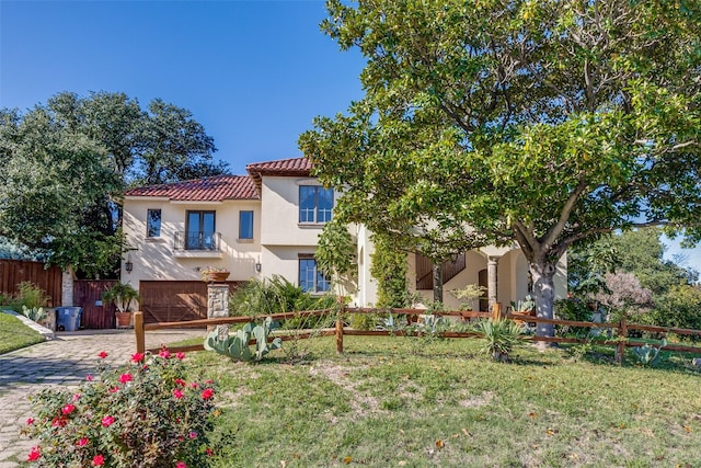 view of front facade featuring a front yard and a garage