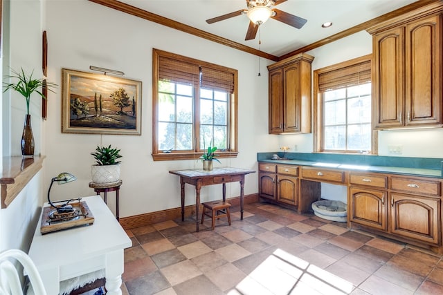 kitchen featuring a healthy amount of sunlight, ceiling fan, and ornamental molding