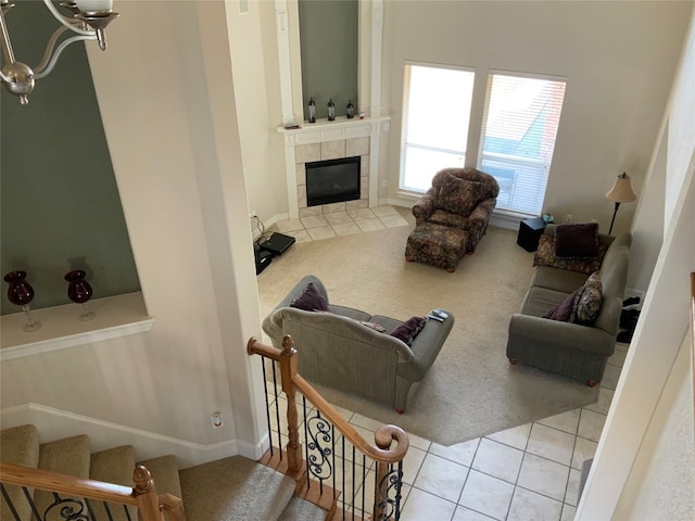 tiled living room with a tiled fireplace