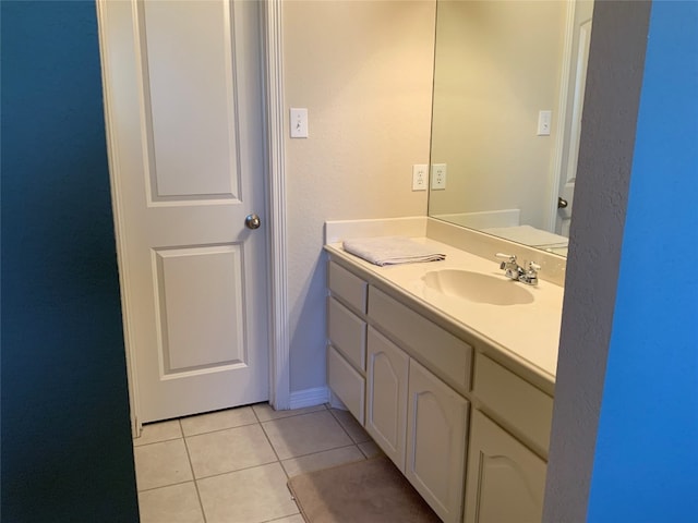 bathroom with vanity and tile flooring