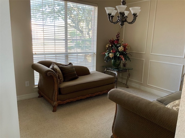 living room featuring a notable chandelier and light colored carpet