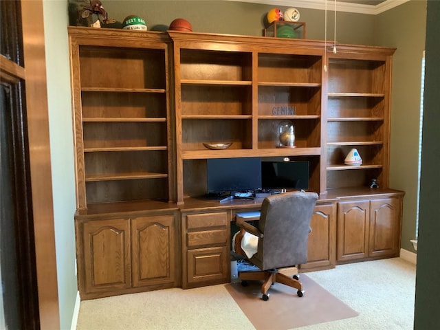 office with built in desk, light carpet, and crown molding