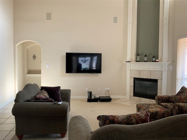 tiled living room featuring a tile fireplace