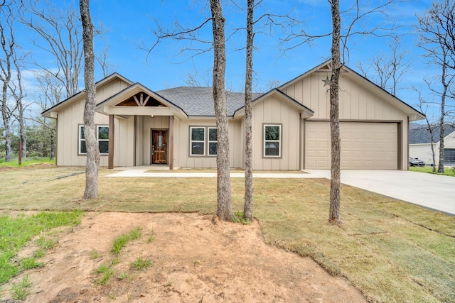 view of front of home with a front lawn and a garage