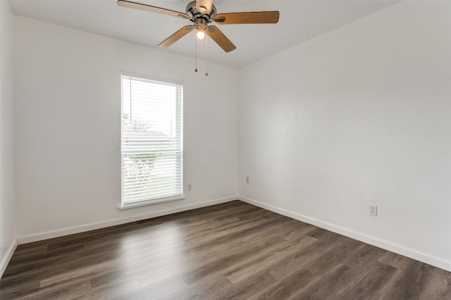 unfurnished room with dark hardwood / wood-style flooring, ceiling fan, and a wealth of natural light