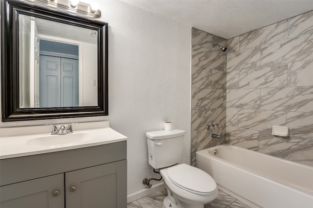 full bathroom with tiled shower / bath, toilet, tile floors, and vanity