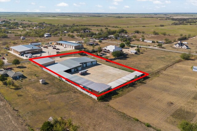 birds eye view of property featuring a rural view