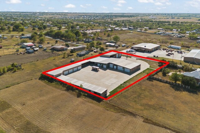 birds eye view of property featuring a rural view