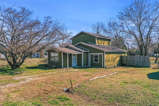 view of side of property featuring a yard