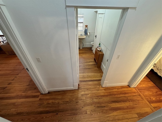 corridor with dark wood-type flooring