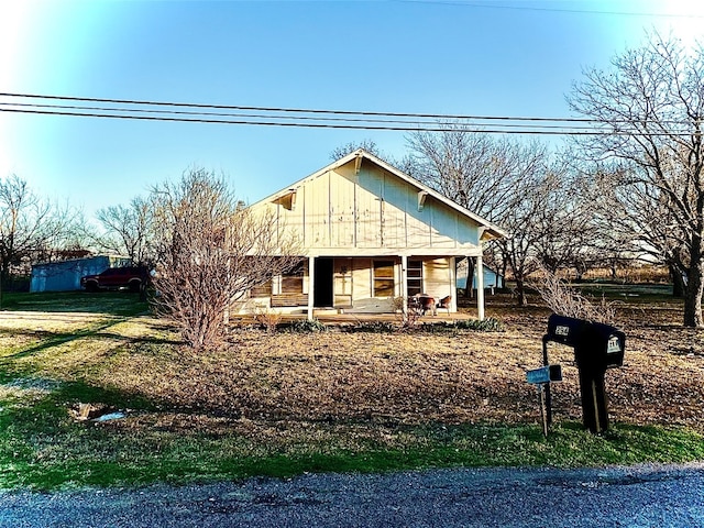 back of house featuring a porch