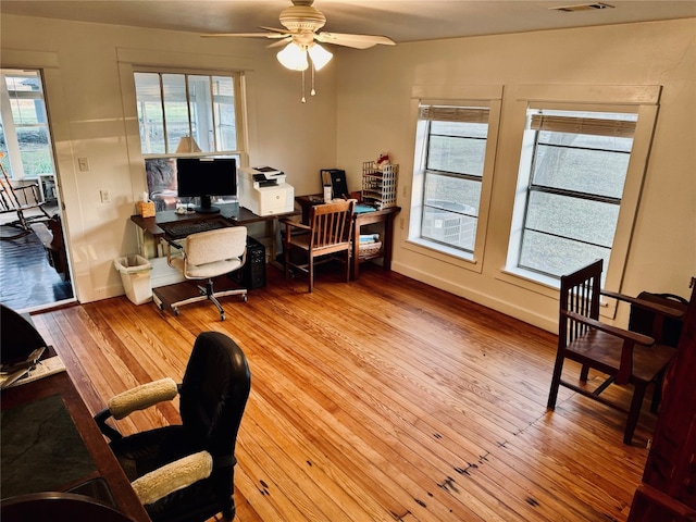 office space featuring light hardwood / wood-style floors and ceiling fan