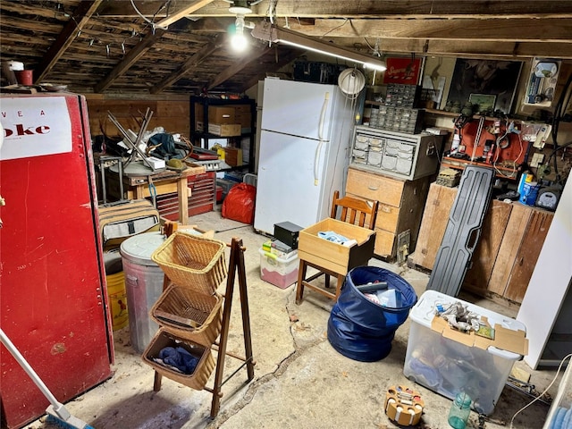 basement featuring white refrigerator