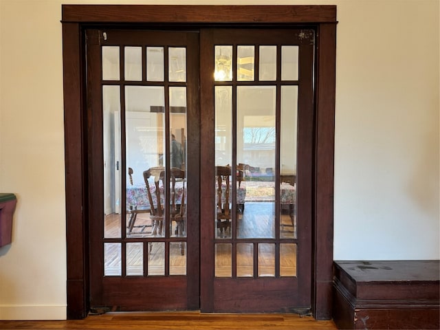 entryway featuring hardwood / wood-style floors and french doors