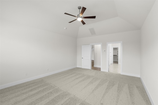 unfurnished bedroom with light carpet, high vaulted ceiling, ceiling fan, and a spacious closet