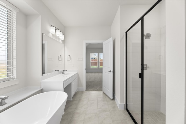 bathroom with large vanity, independent shower and bath, and tile floors