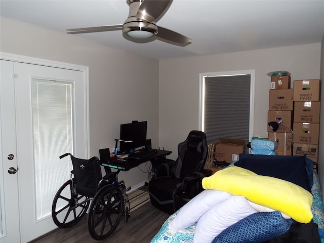 bedroom with dark hardwood / wood-style floors and ceiling fan