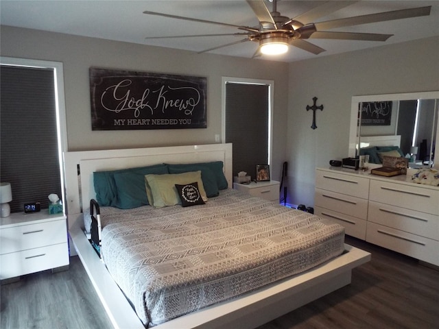 bedroom featuring ceiling fan and dark hardwood / wood-style floors