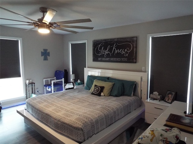 bedroom featuring wood-type flooring and ceiling fan